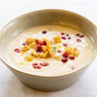 Creamy Cauliflower · A savory smooth blend of miso-roasted cauliflower,topped with pomegranate seeds, olive oil a...