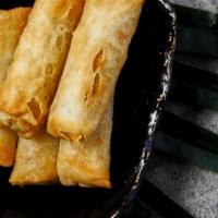 Vegetable Spring Rolls · 5 crispy spring rolls with cabbage, carrot, and mushroom served with sweet chili sauce.