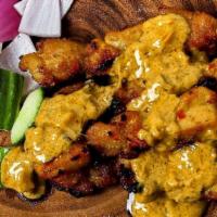 Satay Chicken · Four grilled chicken skewers marinated with spicy peanut sauce