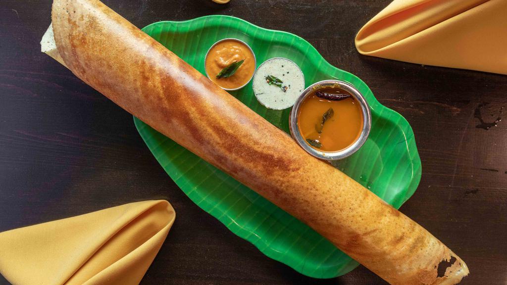 Masala Dosa · Rice and lentil crepe stuffed with potatoes.