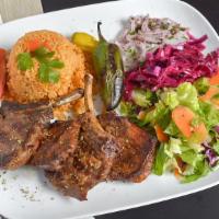 Lamb Chops · For pieces of grilled baby lamb chops served with rice and salad.