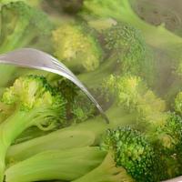 Steamed Broccoli · Served with white rice.