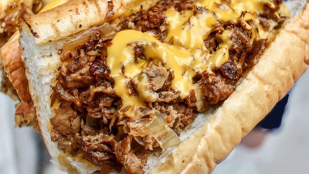 Philly Cheese (Small) · Shaved steak with caramelized onions and cheese sauce