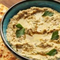 Baba Ganoush · Dip made from a roasted eggplant, tahini sauce, lemon juice, and fresh garlic, topped with o...