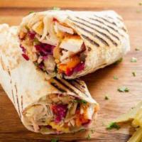 Kofta Kebab · Gluten free. Diced meat with tomatoes, tahini, salad and spices in a wrap.