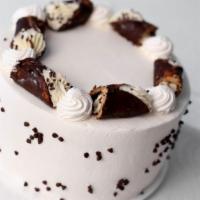 Cannoli · Yellow cake with cannoli cream filling and whipped cream frosting.