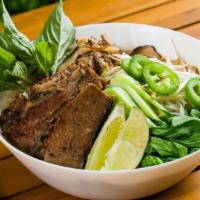 Smoked Brisket Pho · Traditional noodle soup served with 14 hours smoked brisket, rice noodles, shiitake mushroom...