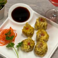 Steamed Dumpling · Vegetable, chicken or pork steamed dumpling served with soy vinaigrette dip.