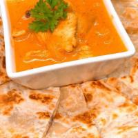 Yellow Curry With Roti · Pan fried roti served with chicken in yellow curry sauce.