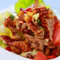 Duck Salad (Spicy) · Crispy duck tossed with chili, red onion, scallions, pineapples, tomatoes and cashew nuts in...
