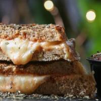Yoely'S American Grill Cheese (On  Sourdough Bread) · Sourdough bread, garlic butter, melted mozzarella cheese, oregano, ketchup, slice tomato.