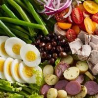Tuna Nicoise Salad · Spring mix, tuna chunks, sliced eggs, nicoise black olives, potatoes,  cherry tomatoes,  and...