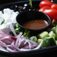 Greek Salad · Sliced cucumbers, tomatoes, Shinly sliced red onion, Kalamata olives, and feta cheese.. Dres...