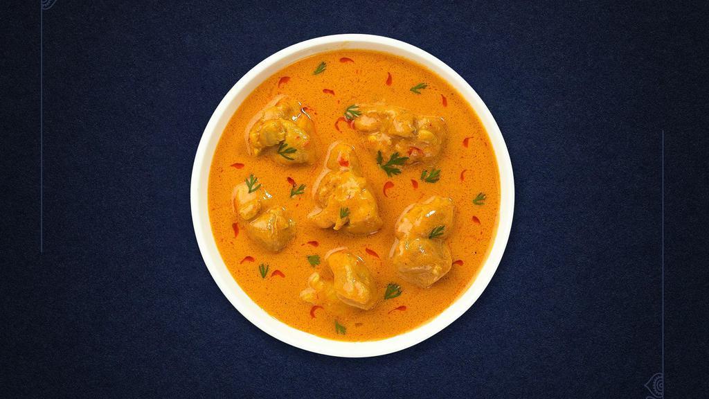Mughlai Pista Korma · Chunks of chicken braised in a mild rich creamy cashew and pista based sauce.