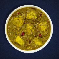 Saag Cluckers · Chicken breast cooked in spinach gravy infused with garlic, ginger, spices and a touch of fe...