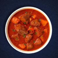 Lamb Vengeance Vindaloo · Lamb cooked with potatoes in a tangy sauce.