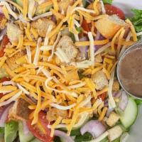 Garden Salad · Romaine mix, tomatoes, onion, cheese, cucumbers, croutons.