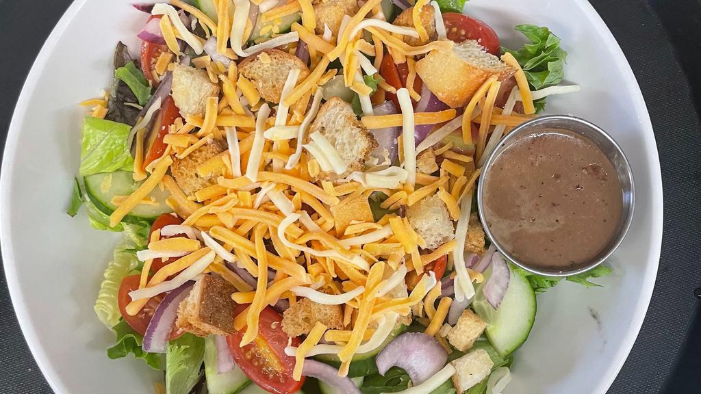 Garden Salad · Romaine mix, tomatoes, onion, cheese, cucumbers, croutons.