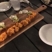 Buffalo Cauliflower · Buttermilk marinade, fried, tossed in buffalo sauce, served with pickled celery & chunky blu...