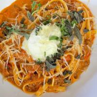 Pasta Bolognese · Fettuccine with a housemade bolognese sauce made with beef, pork & veal.