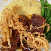 Mom'S Meatloaf · Sweet & spicy tomato glaze, served with mashed potatoes & seasonal vegetables.