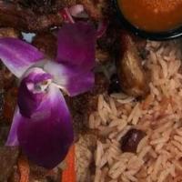 Griot · Tender chunks of fried pork served with rice and beans.