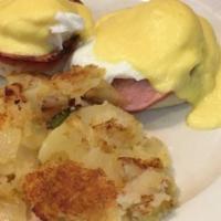 Eggs Benedict · Two poached eggs on a toasted English muffin with Canadian bacon, topped with hollandaise sa...