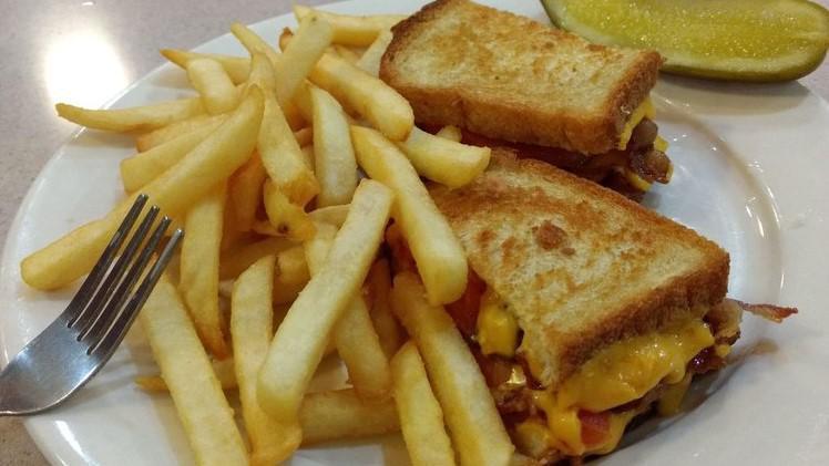 Grilled Cheese Deluxe · With bacon, tomato and french fries.
