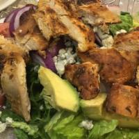 Cobb Salad · Grilled chicken with sliced avocado, corn and blue cheese over mixed greens.