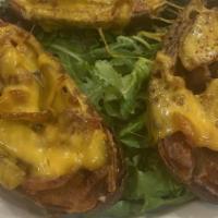 Potato Skins · With bacon and cheddar cheese.