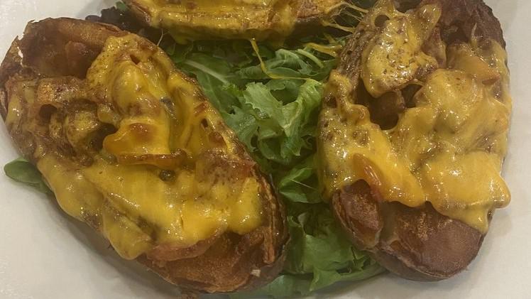 Potato Skins · With bacon and cheddar cheese.