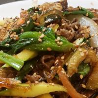 잡채 / Japchae · Stir-fried sweet potato glass noodles in sesame oil and soy sauce with a variety of vegetabl...