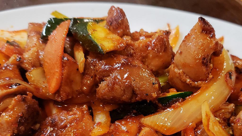 닭볶음 / Stir-Fried Chicken · Stir-fried chicken thighs and vegetables with spicy sauce. Served with kimchi, ban chan (vegetables) and white rice.