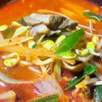 국밥 / Guk Bap · Tender beef and assorted vegetables in spicy egg drop soup. Served with kimchi, ban chan (Ve...
