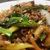 Japchae /  잡채 · Stir-fried sweet potato glass noodles in sesame oil and soy sauce with a variety of vegetabl...