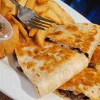 Gyro Quesadilla · Flour tortilla grilled filled with gyro, sautéed onions, tomatoes, feta cheese. Served with ...