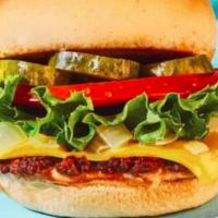 Veg-E-Licious Burger · Veggie lovers favorite, vegie patty, house sauce, leaf lettuce, Roma tomato, pickles, shaved...