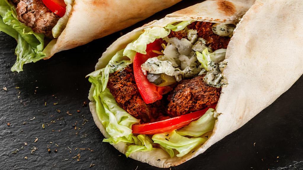 Falafel Gyro Wrap · Chunks of Falafel in Gyro bread with Lettuce, Tomato, Onion, Green peppers & Gyro sauce