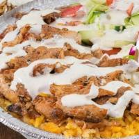 Chicken Gyro Over Rice · Chunks of Chicken on Rice with Lettuce, Tomato, Onion, Green peppers & Gyro sauce