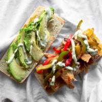 Chicken Fajita Sandwich · Grilled chicken, red and green peppers, onions, avocado, Cheddar cheese, and spicy cilantro ...