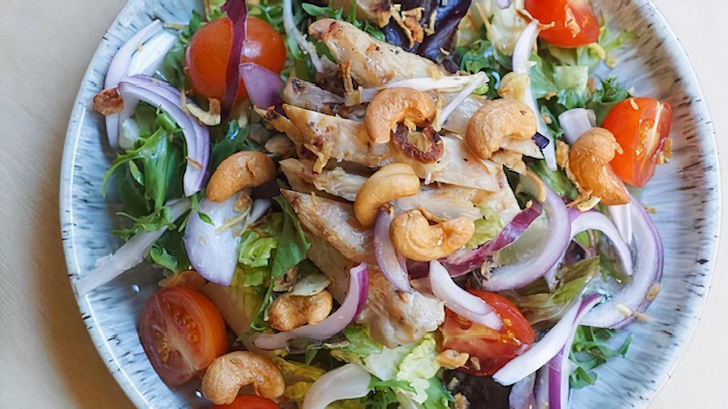 Grilled Chicken Salad · Grilled marinated chicken, cashew nut, red onion, tomato, scallion, rice powder, fried shallot, chili-lime dressing.