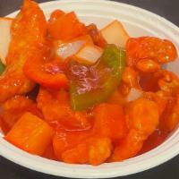 Sweet & Sour Fish · Sliced fillet crispy fish in sweet and sour sauce with bell peppers onions and pineapple