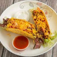 Steak Taco · Served with iceberg lettuce tomato. topped with cheddar cheese.