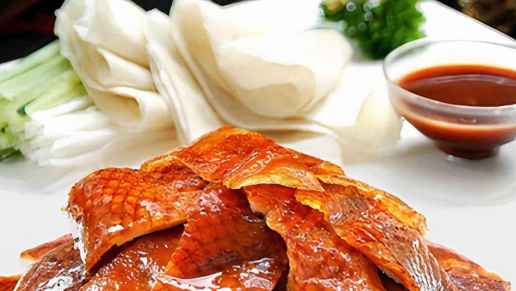 北京鴨 / S01. Peking Duck (Two-Course Whole Duck) · Roasted duckling prepared in traditional Peking Style. 1. Skin in Crêpes. 2. Duck meat sautéed w. onion, pepper, and celery.