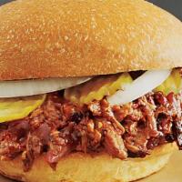 Bbq Chopped Brisket Sandwich · Smoked and chopped beef brisket with coleslaw and bbq sauce on a fluffy bun.