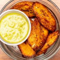 Sweet Fried Plantains · Whole sweet plantain, sliced and seasoned with salt, pepper, and nutritional yeast. Deep fri...