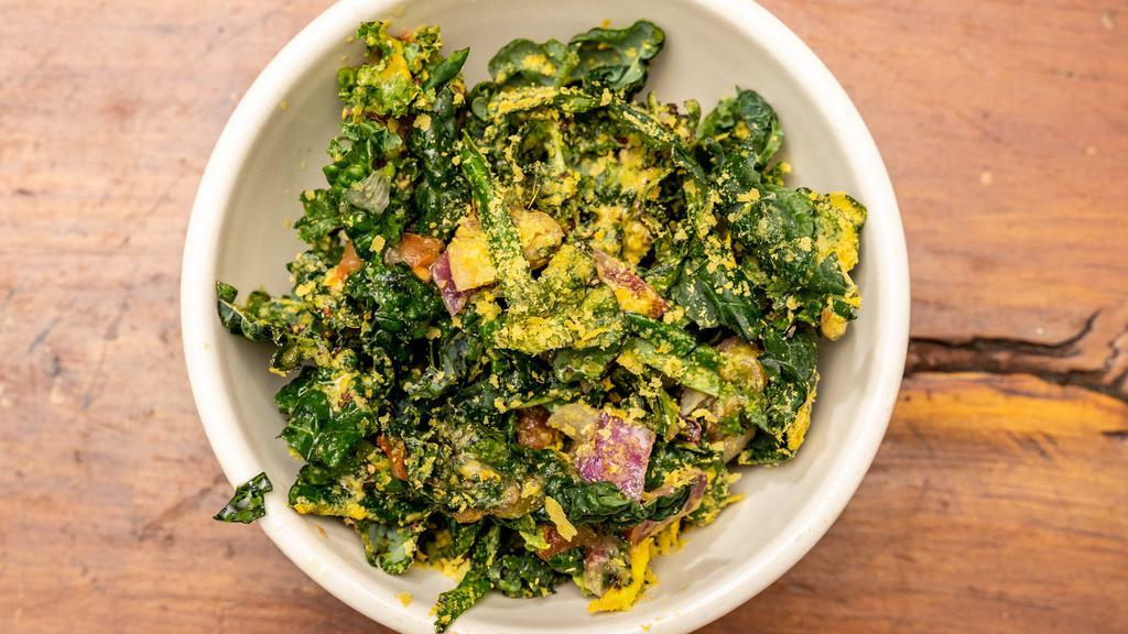Small Kale Salad · Black kale, red onions and tomatoes tossed in our fresh marinade of lemon, olive oil, nutritional yeast and S+P. Clean eats!