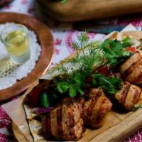 Chicken Shashlik · Chicken Thighs Marinated with Herbs, Onions, Tomatoes, Kefir and then Roasted. Served with F...