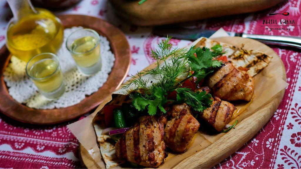 Chicken Shashlik · Chicken Thighs Marinated with Herbs, Onions, Tomatoes, Kefir and then Roasted. Served with Fresh Salad with Pickles and Vegetables, Dressed with Mayonnaise