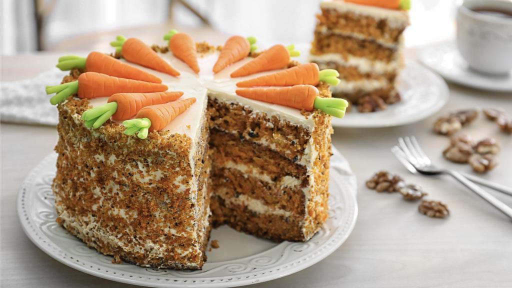 Carrot Cake · Delicious shredded carrot cake slice.